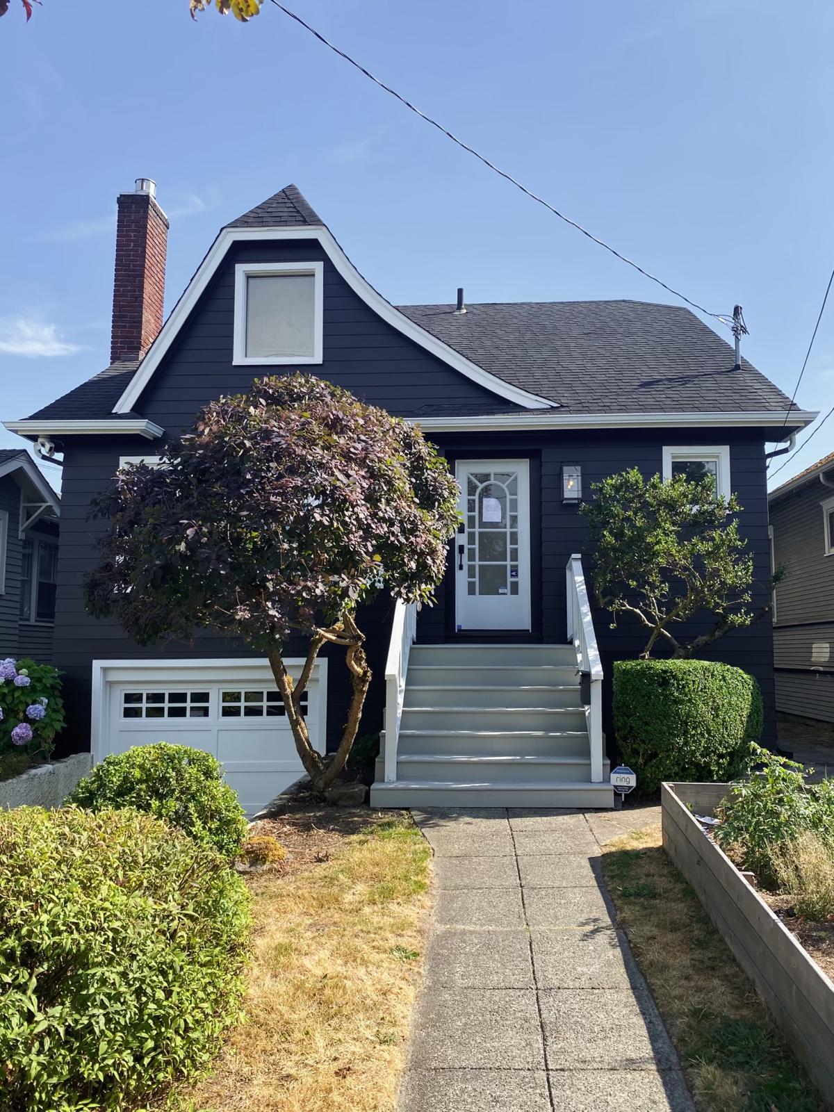 Dark blue freshly painted house by Art of Painting Custom Restoration LLC, featuring early booking painting discount in Everett WA.