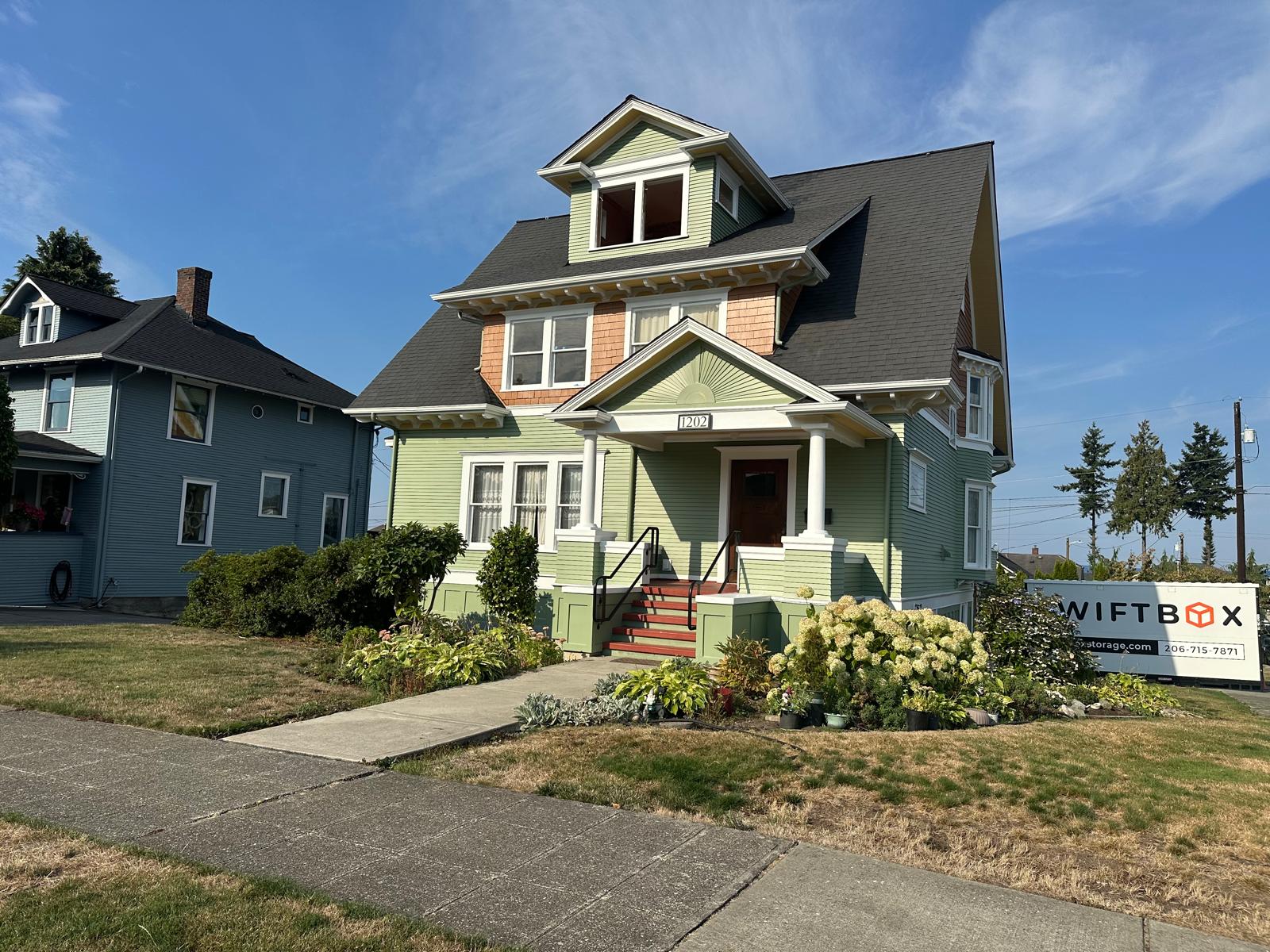 Freshly painted home exterior showcasing quality work by Art of Painting Custom Restoration LLC, highlighting early booking painting discount in Everett WA.
